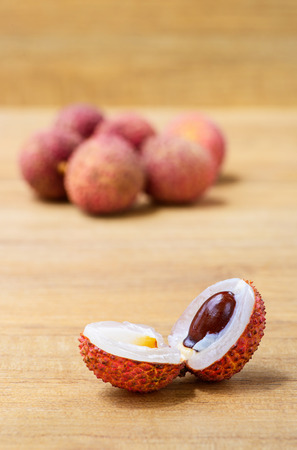 Fresh lychee on a wooden backgroundの写真素材