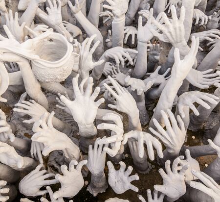 Abstract hands statue from Hell in Wat Rong Khun White Temple at Chiang Rai, Thailandの写真素材
