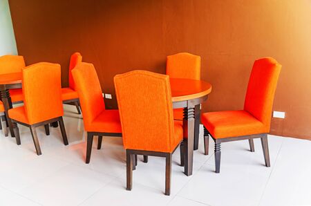 Empty tables and chairs in roomの写真素材