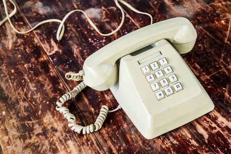 Retro telephone on wooden table.の写真素材