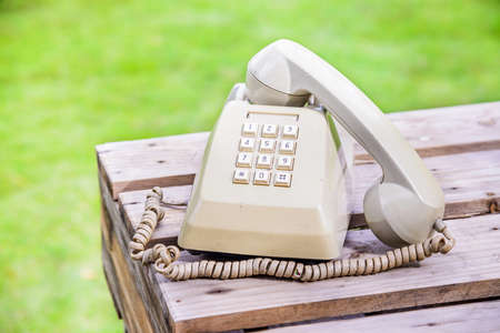 Retro telephone on wooden table.の写真素材