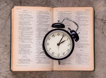 Alarm clock and Holy bibleの写真素材
