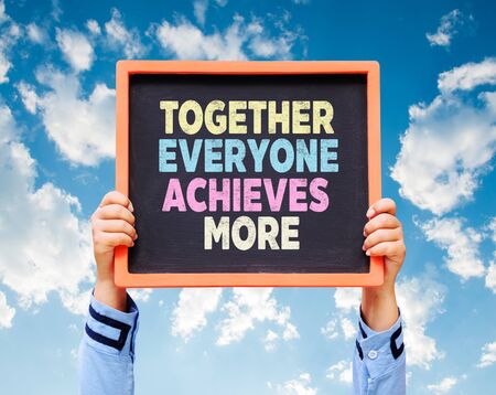Together Everyone Achieves More - TEAM Concept on chalkboard.の写真素材