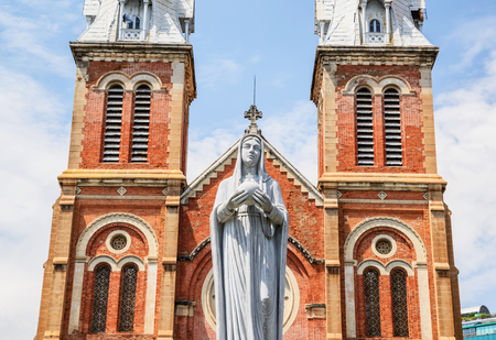HO CHI MINH CITY, VIETNAM - NOVEMBER 2: Virgin Mary statue in front of Notre-Dame Cathedral landmark in Ho Chi Minh City, Vietnam on November 2, 2015. Ho Chi Minh is a popular tourist destination of Asia.のeditorial素材
