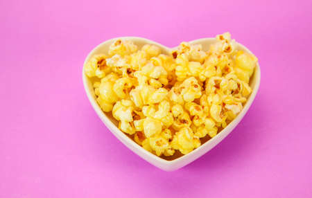 popcorn in heart shape bowlの写真素材