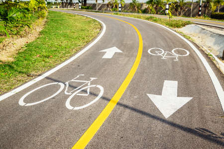 Bicycle sign on bicycle lane in morning sunshine. The main focus is at the symbol.の写真素材
