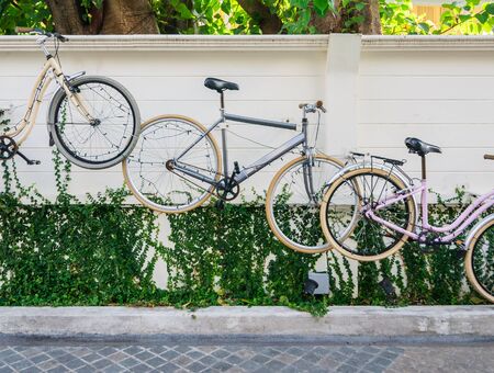 Bicycles hanging on wall for decoration.