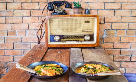 Old retro radio on wood table in lunch room