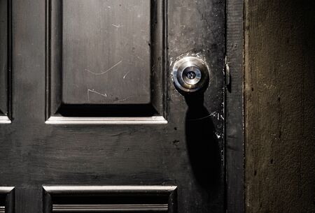 Door Knob On Black Door And Light From Top Ceilingの素材 Fy ストックフォトのamanaimages Plus