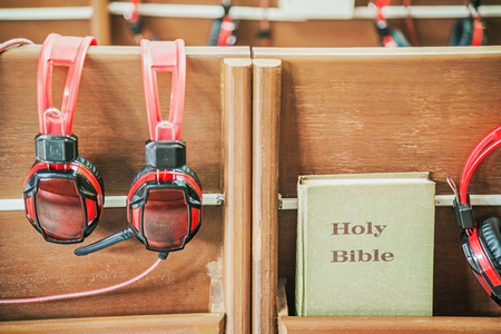 Bible and Headphones in church.の写真素材