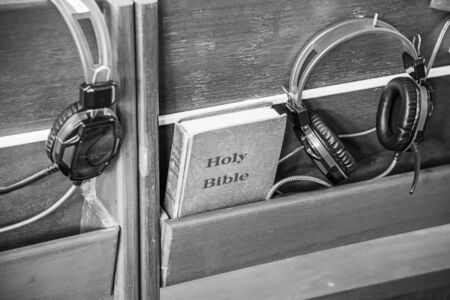 Bible and Headphones in church.の写真素材