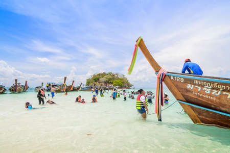 KRABI,THAILAND - MAY 7, 2016:  Tourists enjoying the beautiful miracle beach & crystal clear water...