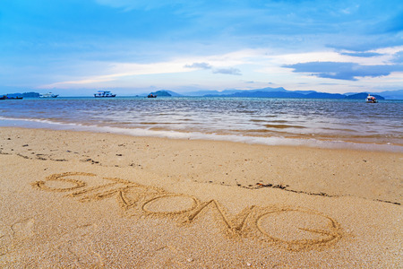 Strong written on sandの写真素材