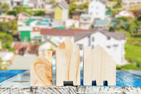 Mini houses and many houses in backgroundの写真素材