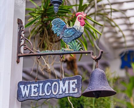 Doorbell welcome to home, Old cock symbol bell for ring and welcome of houseの写真素材
