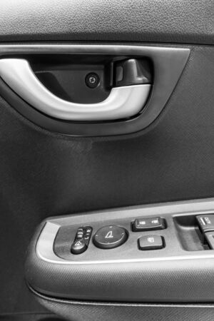 Car window control buttons. Control on door panel.