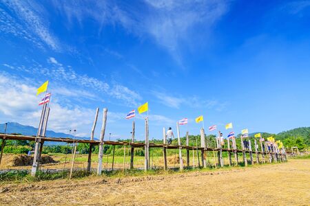 Long bamboo bridge in rural green rice fields, name " Sutongpe Bridge ".  The longest wooden bridge located in Mae Hong Son province ,Thailand.の写真素材