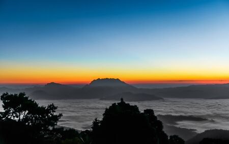 Morning sunrise over mist , Huai Nam Dang National Park, Chiang Mai, Thailand, landscape, travel and nature conceptの写真素材
