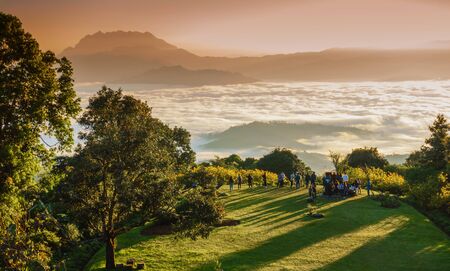 Tourists and Morning sunrise over mist , Huai Nam Dang National Park, Chiang Mai, Thailand, landscape, travel and nature conceptのeditorial素材