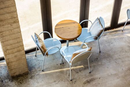 Top view of wooden tables and chairs in coffee shop