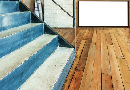 stairway concrete and wooden floor with blank billboard