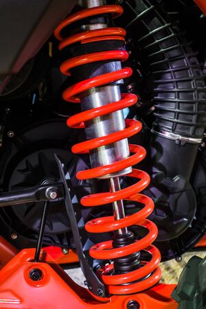 Closeup of springs, red shock absorbers motorcycle