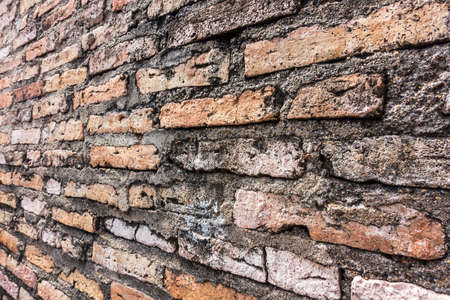Brown brick wall in an old contemporary temple in Thailandの写真素材