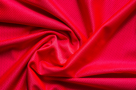 Red jersey fabric texture background, sports wear background.の写真素材