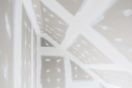 Ceiling on the construction site and installation of ceiling gypsum boardの写真素材