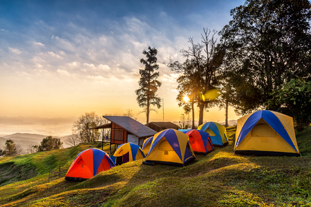 Camping tents on the top of mountain during sunrise at San pa kia to see Doi Luang Chiangdao, Chiang Mai, Thailand.の写真素材