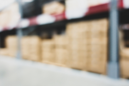 Blurred large furniture warehouse with row of aisles. Industrial storehouse interior. Inventory, wholesale, logistic, export with vintage filterの写真素材