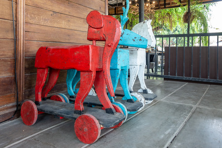 Vintage rocking animal in old house. Old rustic toy in wooden houseの写真素材