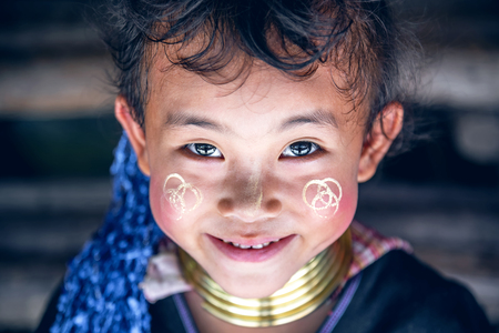 CHIANG MAI, THAILAND - JUNE 3, 2018 : Close-up Unidentified little girl's face with a smile and beautiful eyes looking at the camera. Little girl looking up and Photographed from above.のeditorial素材