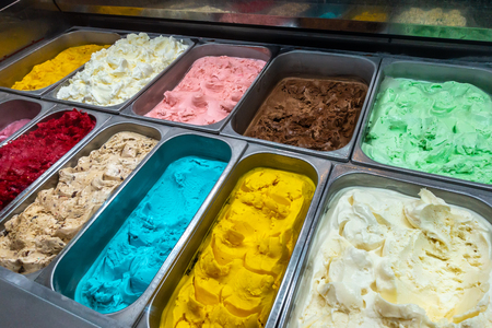 Colorful ice cream tray, gourmet gelato ice cream display in shopの写真素材