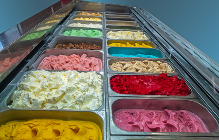 Colorful ice cream tray, gourmet gelato ice cream display in shopの写真素材