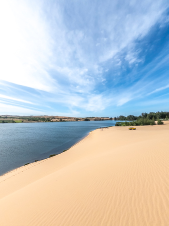 White sand dunes and blue sky background in Mui Ne , South of Vietnamの写真素材