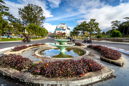 DALAT, VIETNAM - JANUARY 17, 2019 : Fountain round beside Than Tho Lake in Dalat, Vietnam.  The lake is tranquil, surrounded by lakes and pine forest.のeditorial素材