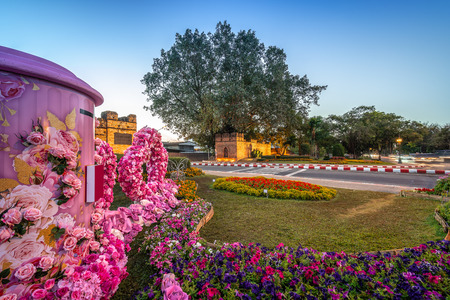 Suan Dok Gate. West Gate of Chiang Mai Old City. Located in Chiang Mai, Thailand. Text on the board translating into English is Suan Dok Gate. Historical heritage landmark in downtown.の写真素材