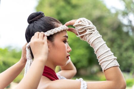 Muay thai, Asian woman Thai boxing, Thailand. Asia thai boxer muay thai with traditional hemp ropes.の写真素材