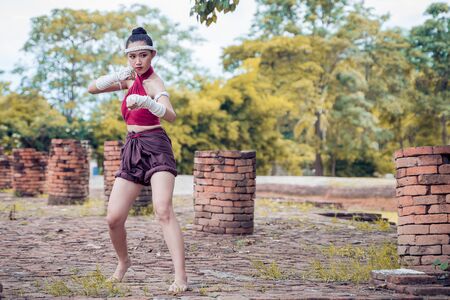 Muay thai, Asian woman Thai boxing, Thailand. Asia thai boxer muay thai with traditional hemp ropes.の写真素材
