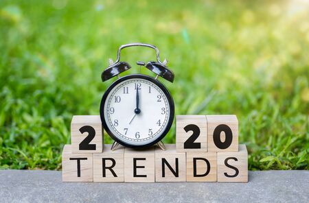 The word trends and 2020 new year on wooden cube blocks. 2020 trends concept. Main trend of changing something in new year.の写真素材