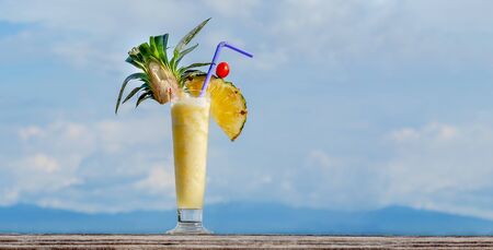 Pineapple smoothies Cocktail, Fresh Pineapple Smoothie with slice of Pineapple with nature background.の写真素材
