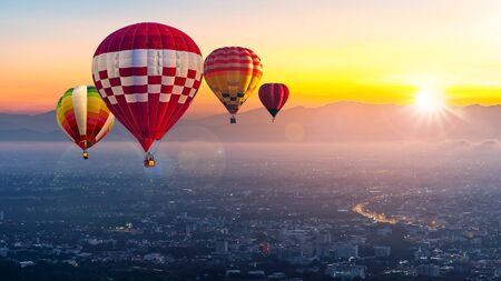 Chiang Mai, Doi Suthep in Thailand at sunrise -Landscape with hot air balloons flying over Chiang...