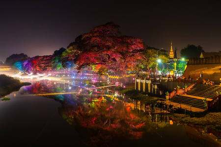 LAMPHUN, THAILAND - NOVEMBER 10, 2019 : Symphony of Lights is the spectacular light and sound show at City Wall beside the river near Wat Phra That Hariphunchai Temple for celebration in Loy Krathong Festival day in Thai old culture.のeditorial素材