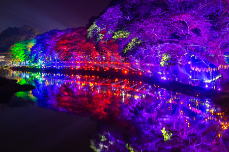 LAMPHUN, THAILAND - NOVEMBER 10, 2019 : Symphony of Lights is the spectacular light and sound show at City Wall beside the river near Wat Phra That Hariphunchai Temple for celebration in Loy Krathong Festival day in Thai old culture.のeditorial素材