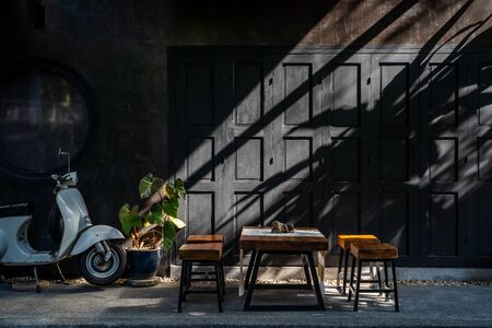 Black wooden vintage door and sun light shining for decorativeの写真素材