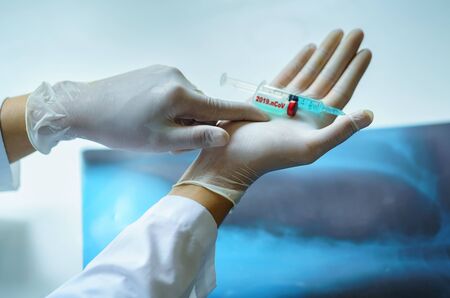 Doctor holding Syringe injection and Vaccine, Prevention, immunization and treatment from corona...
