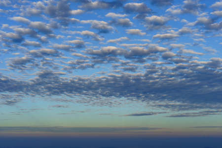 Cirrocumulus Cloud on a clear blue sky. Cirrus clouds in blue sky on sunny day. Altocumulus cloud on the blue sky. Fish scale cloud.の写真素材