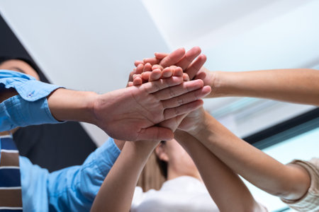 Stack of hands. Close up of young business people putting their hands together. Unity, teamwork and Join concept. Group of Diverse Hands Togetherの写真素材