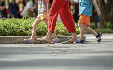 Mother and her son walking on the streets at organic market of Chiang Mai, Thailandの写真素材